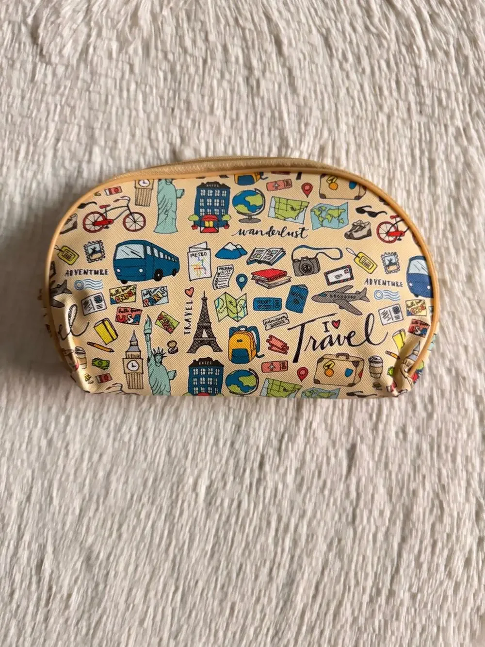 Cream Travel-themed pencil case/ make up bag  with l travel icons '